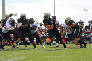 Senior RB Dylan Rupert takes off for a run to the left side. (Photo By Anna Schifter)