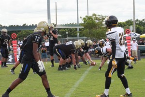 Senior QB Lucas Tellefsen prepares to snap the ball with his offensive line ready to block. (Photo By Anna Schifter)