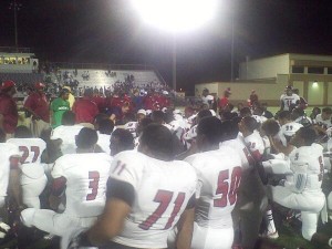 The Miramar Patriots gather around for a post-game talk after defeating St. Thomas Aquinas on the road Friday night.  (Photo By Nash Williams)