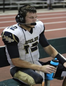 Eagles’ quarterback David Vozzola watches from the sideline Friday during the final minutes of his last high school game. (Photo: Morgan Sherman)