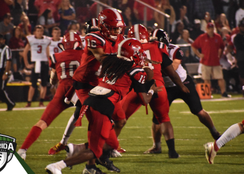 Jeremiah McKenzie hands the ball off to Willie Pollard during the third quarter of Bradford's 28-17 victory over arch rival Baker County for the Class 2S-Region 2 Championship on Friday, Nov. 25, 2022 at David Hurse Stadium in Starke, Fla. [Joshua Wilson/FloridaHSFootball.com]