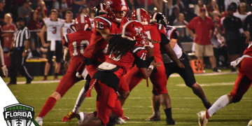 Jeremiah McKenzie hands the ball off to Willie Pollard during the third quarter of Bradford's 28-17 victory over arch rival Baker County for the Class 2S-Region 2 Championship on Friday, Nov. 25, 2022 at David Hurse Stadium in Starke, Fla. [Joshua Wilson/FloridaHSFootball.com]