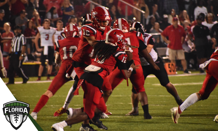 Jeremiah McKenzie hands the ball off to Willie Pollard during the third quarter of Bradford's 28-17 victory over arch rival Baker County for the Class 2S-Region 2 Championship on Friday, Nov. 25, 2022 at David Hurse Stadium in Starke, Fla. [Joshua Wilson/FloridaHSFootball.com]