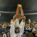 Chaminade-Madonna HC Dameon Jones holds up the Class 1M State Championship trophy after the Lions defeated Clearwater Central Catholic 48-14 on Thu., Dec. 8, 2022 at Gene Cox Stadium in Tallahassee, Fla. [Joshua Wilson/FloridaHSFootball.com]