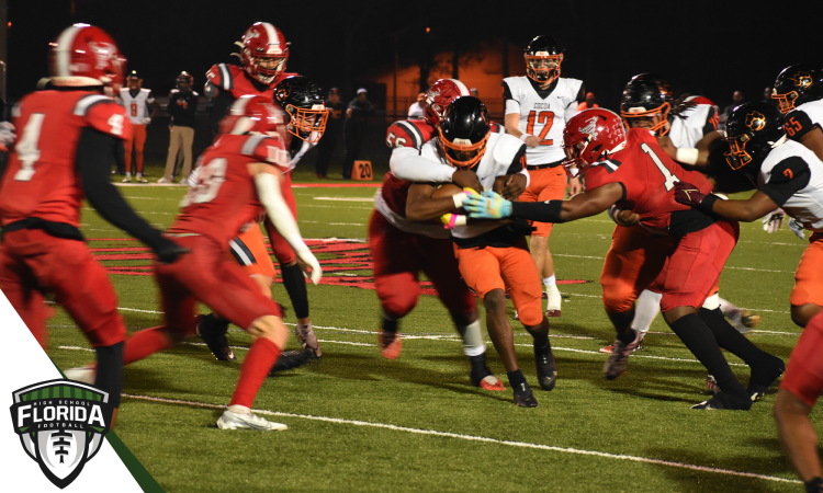 Cocoa's Cedrick Hawkins carries the ball with a swarm of Bradford tacklers coming at him during the Class 2S State Semifinal on Fri. Dec. 2, 2022 at David Hurse Stadium in Starke, Fla. [Joshua Wilson/FloridaHSFootball.com]