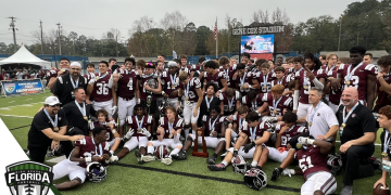 First Baptist (Naples) posses with the 2022 FHSAA Class 1S State Championship trophy after defeating Trinity Catholic (Ocala) 21-3 on Saturday, December 10, 2022 at Gene Cox Stadium in Tallahassee, Fla. [Joshua Wilson/FloridaHSFootball.com]