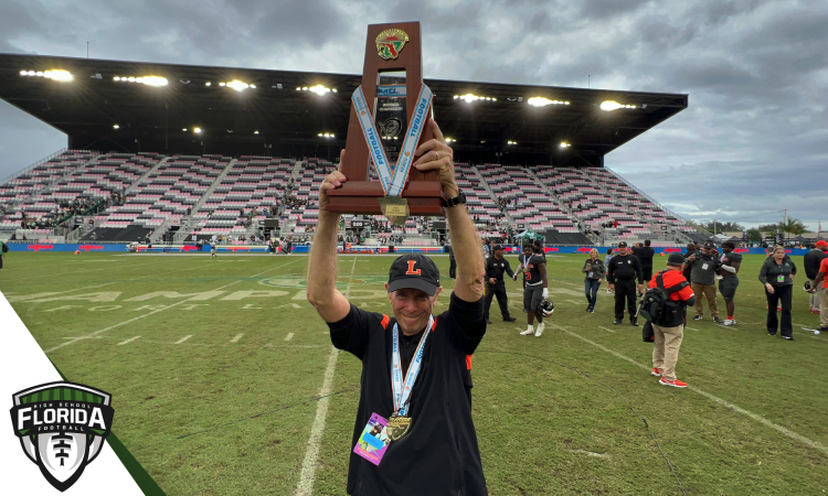 Bill Castle holds up the 2022 Class 4S State Championship after Lakeland defeated Venice 21-14 on Saturday, December 17, 2022 at DRV PNK Stadium in Fort Lauderdale, Fla. Castle announced his retirement on Tuesday, January 3, 2023 after 52 years total at Lakeland including the last 47 as head coach.