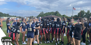Alonso and Robinson celebrate on the field after winning the FHSAA Class 2A and Class 1A girls flag football state championships at Mandarin High School in Jacksonville, Fla. on Sat. May 13, 2023. [Photo by Robert Rahn, FloridaHSFootball.com]