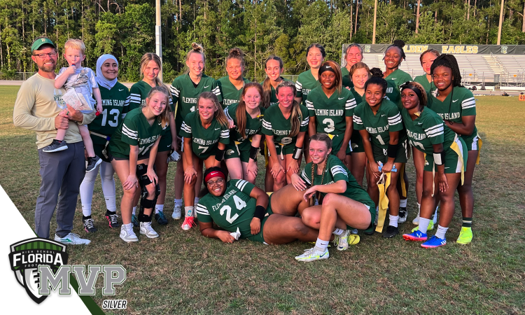 The Fleming Island Golden Eagles girls flag football team posses after coming from behind to defeat Spruce Creek in the Class 2A-Region 1 final on Mon., May 8, 2023 at Randy Warren Stadium in Fleming Island, Fla. [Joshua Wilson, FloridaHSFootball.com]