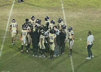 Buchholz (Gainesville) huddles up during a timeout during their 44-7 blowout victory over Bartram Trail (St. Johns) at Citizens Field in Gainesville, Fla. on Thu. Oct. 19, 2023. [Joshua Wilson/FloridaHSFootball.com]