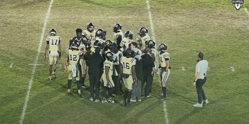 Buchholz (Gainesville) huddles up during a timeout during their 44-7 blowout victory over Bartram Trail (St. Johns) at Citizens Field in Gainesville, Fla. on Thu. Oct. 19, 2023. [Joshua Wilson/FloridaHSFootball.com]