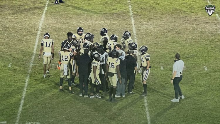 Buchholz (Gainesville) huddles up during a timeout during their 44-7 blowout victory over Bartram Trail (St. Johns) at Citizens Field in Gainesville, Fla. on Thu. Oct. 19, 2023. [Joshua Wilson/FloridaHSFootball.com]