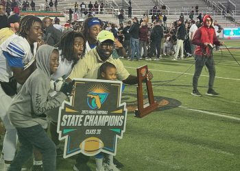 Travis Roland poses with the Class 3S State Championship trophy after the Buccaneers defeated St. Augustine 21-19 on Thu. Dec. 7, 2023 at Ken Riley Field at Bragg Memorial Stadium in Tallahassee, Fla. [Joshua Wilson/FloridaHSFootball.com]