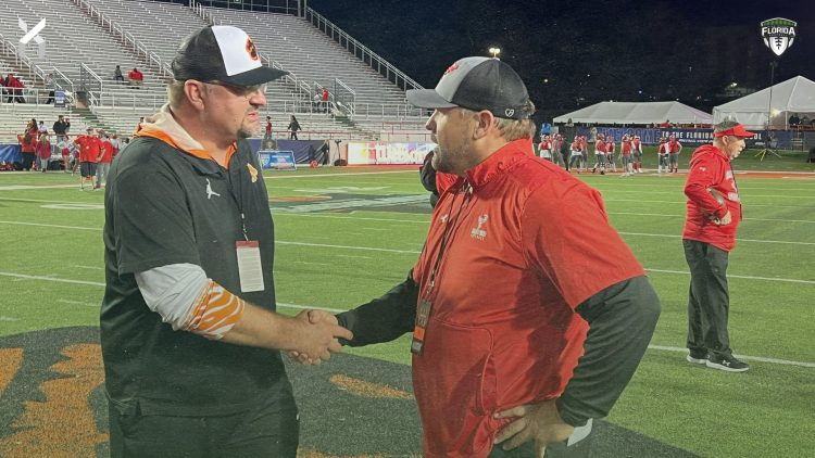 Cocoa Head Coach Ryan Schneider and Bradford (Starke) Head Coach Jamie Rodgers shake hands prior to the Class 2S State Championship game on Fri. Dec. 8, 2023 at Ken Riley Field at Bragg Memorial Stadium in Tallahassee, Fla. [Joshua Wilson/FloridaHSFootball.com]