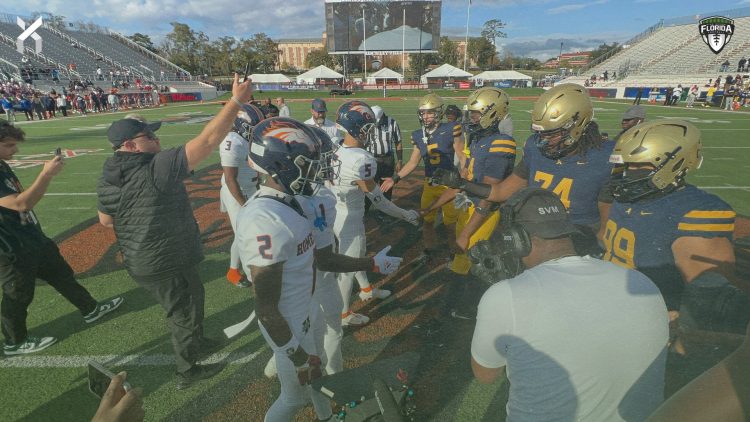 Homestead and St. Thomas Aquinas (Fort Lauderdale) team captains meet at midfield prior to the Class 3M State Championship game on Sat, Dec. 9, 2023 at Ken Riley Field at Bragg Memorial Stadium in Tallahassee, Fla. [Joshua Wilson/FloridaHSFootball.com]