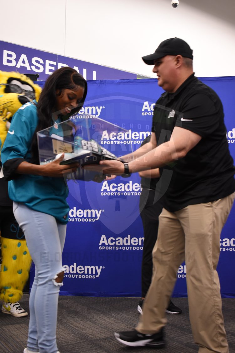 London Jenkins, Fleming Island, receives the 2024 Player of the Year Award at the 2024 Jaguars All-PREP Flag Football recognition event held at Academy Sports + Outdoors on Southside Blvd. on Wed. May 8, 2024, in Jacksonville, Fla. [Joshua Wilson/FloridaHSFootball.com]