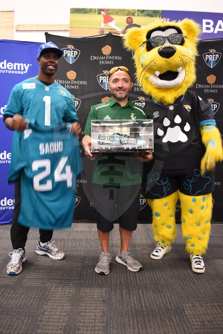 Ed White (Jacksonville) Flag Football Head Coach Bachir Saoud poses with Jacksonville Jaguars RB Travis Etienne Jr. and Jaxon De Ville after being announced as the Jaguars PREP 2024 Coach of the Year at the 2024 Jaguars All-PREP Flag Football recognition event held at Academy Sports + Outdoors on Southside Blvd. on Wed. May 8, 2024, in Jacksonville, Fla. [Joshua Wilson/FloridaHSFootball.com]