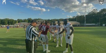 Middleburg and Oak Hall captains shake hands at midfield prior to their spring football game on Thu. May 23, 2024 in Gainesville, Fla. [Joshua Wilson/FloridaHSFootball.com]