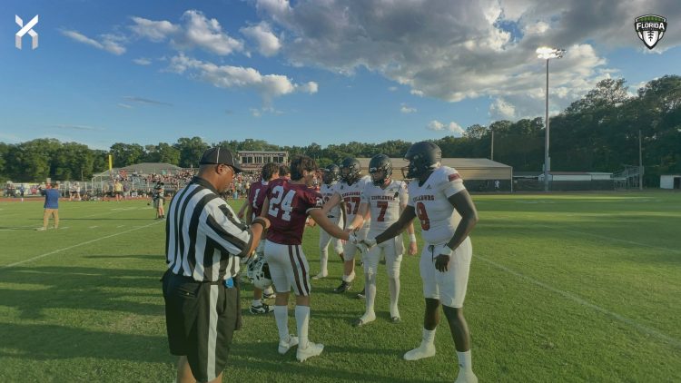 Middleburg and Oak Hall captains shake hands at midfield prior to their spring football game on Thu. May 23, 2024 in Gainesville, Fla. [Joshua Wilson/FloridaHSFootball.com]