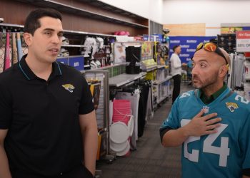 Adriel Rocha, Jacksonville Jaguars VP of Community Impact and Football Development talks with 2024 Coach of the Year, Bachir Saoud of Ed White (Jacksonville) during the 2024 Jaguars All-PREP Flag Football recognition event held at Academy Sports + Outdoors on Southside Blvd. on Wed. May 8, 2024, in Jacksonville, Fla. [Joshua Wilson/FloridaHSFootball.com]