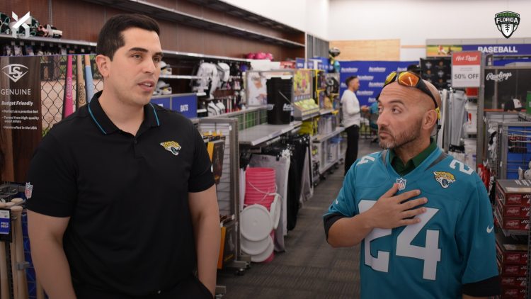 Adriel Rocha, Jacksonville Jaguars VP of Community Impact and Football Development talks with 2024 Coach of the Year, Bachir Saoud of Ed White (Jacksonville) during the 2024 Jaguars All-PREP Flag Football recognition event held at Academy Sports + Outdoors on Southside Blvd. on Wed. May 8, 2024, in Jacksonville, Fla. [Joshua Wilson/FloridaHSFootball.com]