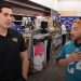 Adriel Rocha, Jacksonville Jaguars VP of Community Impact and Football Development talks with 2024 Coach of the Year, Bachir Saoud of Ed White (Jacksonville) during the 2024 Jaguars All-PREP Flag Football recognition event held at Academy Sports + Outdoors on Southside Blvd. on Wed. May 8, 2024, in Jacksonville, Fla. [Joshua Wilson/FloridaHSFootball.com]