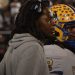 Miami Northwestern Head Coach Teddy Bridgewater and QB Leon Strawder huddle up the rest of the Bulls offense during a time out during the recent 2024 FHSAA Class 3A State Championship. Strawder was among three athletes that stood out in the 2024 FHSAA Class 3A State Championship Game on Sat. Dec. 14, 2024, at South Dade Kia Field at Pitbull Stadium in Miami [Joshua Wilson/FloridaHSFootball.com]