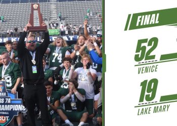 Venice head coach John Peacock hoists up the 2024 Class 7A State Championship trophy after the Indians defeated Lake Mary 52-19 on Sat. Dec. 14, 2024 at South Dade Kia Field at Pitbull Stadium in Miami, Fla. [Joshua Wilson/FloridaHSFootball.com]