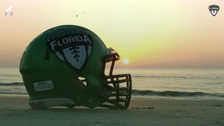 The Florida High School Football Helmet on display on the beach as the sun rises. [Joshua Wilson/FloridaHSFootball.com]