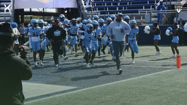 Gadsden County runs out on to the field at Pitbull Stadium in Miami, Fla. prior to the 2024 FHSAA Class 2A State Championship Game. [Joshua Wilson/FloridaHSFootball.com]